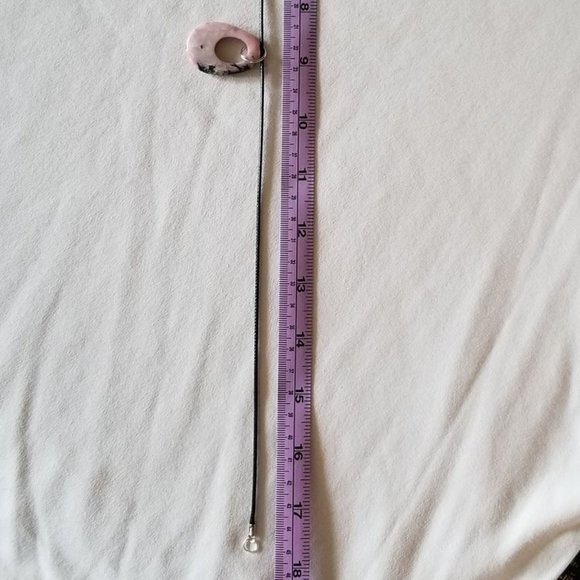 Pink rhodonite gemstone with black veining, natural pendant on a black cord. - Picture 6 of 6